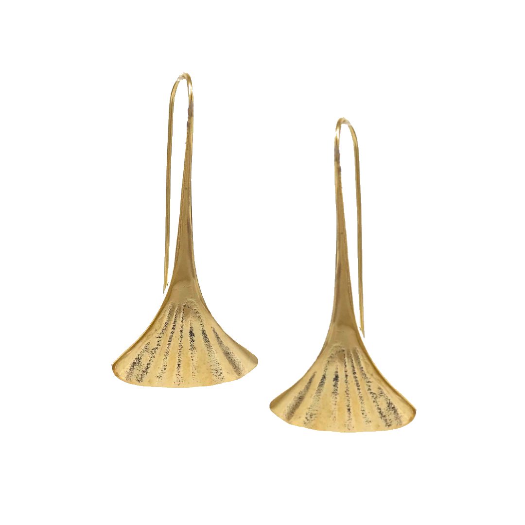 Pair of gold toned gingko shaped earrings on a white background