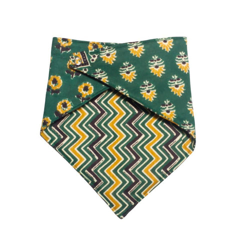 Green bandana bib with flower and zigzag pattern on a white background