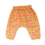 Load image into Gallery viewer, Yellow pants with pink floral pattern on a white background
