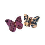 Load image into Gallery viewer, Two butterfly-shaped hair accessories on a white background
