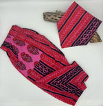 Load image into Gallery viewer, Pink and black patterned pants with matching bib on a white background
