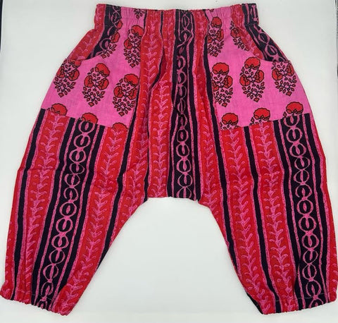 Pink, red and black patterned pants on a white background