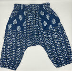 Load image into Gallery viewer, Blue pants with white floral pattern on a white background
