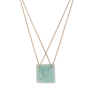 Necklace with a square green pendant on a white background