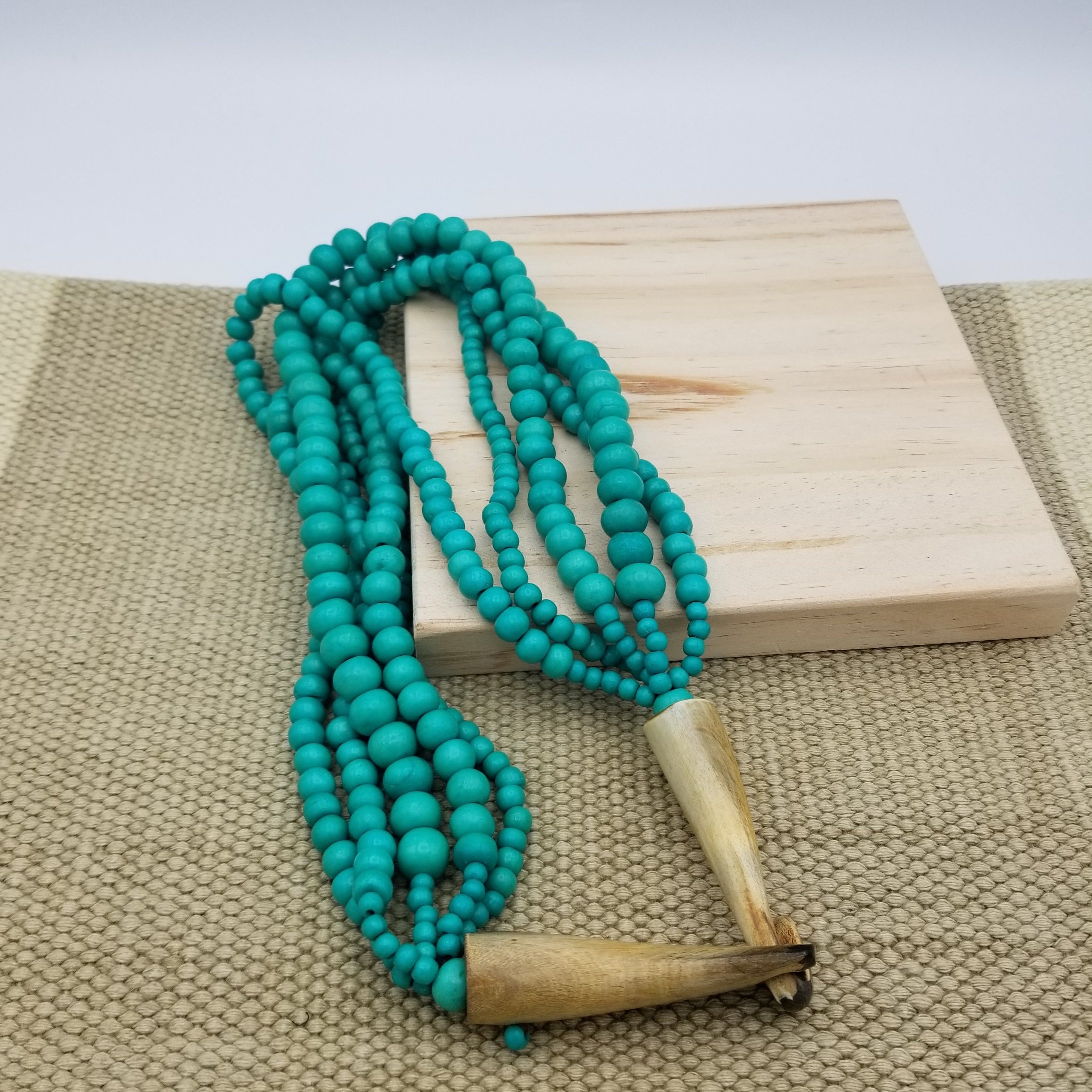 Bone Bead Necklace with Horn Clasp