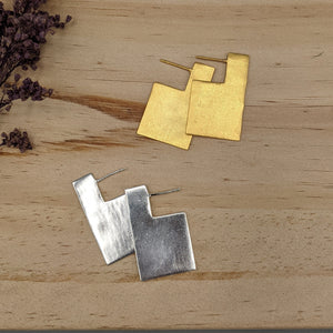 Shiny gold or silver one-dimensional rectangle with a modern side-facing profile, about 1.5" long